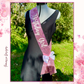 Celebrate in style with this stunning Pink Sequins Sash, perfect for making any birthday girl shine! Adorned with sparkling sequins and “Birthday Girl” elegantly written in white, this sash adds a touch of glamour to any outfit.