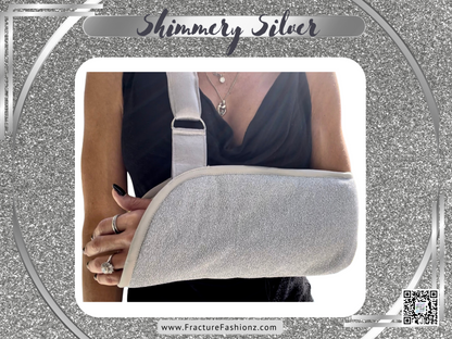 padded arm sling made of shimmery silver fabric and a silver satin strap