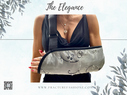 fashionable padded arm sling in a silver organza fabric with a delicate embroidered floral pattern