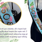 Ceinture en satin noir avec sequins et inscription dorée, bordée d'un galon doré