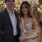 girl in homecoming formal gold sequins arm sling